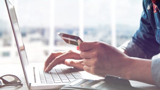 Person Shopping Online Using  Laptop