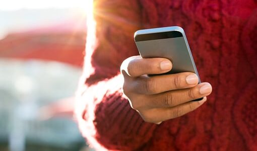 Man performing Google search on mobile device.